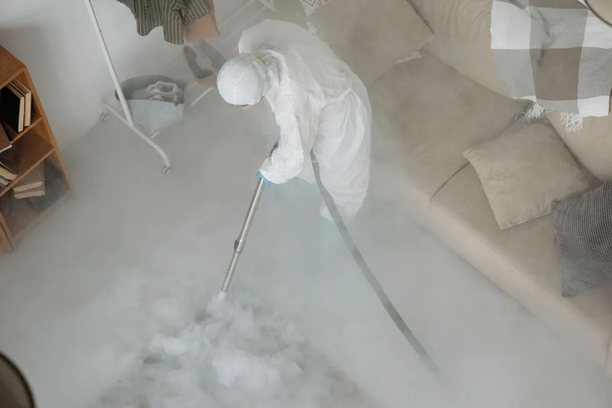 Biohazard cleanup technician in protective equipment, Centre Hall, PA